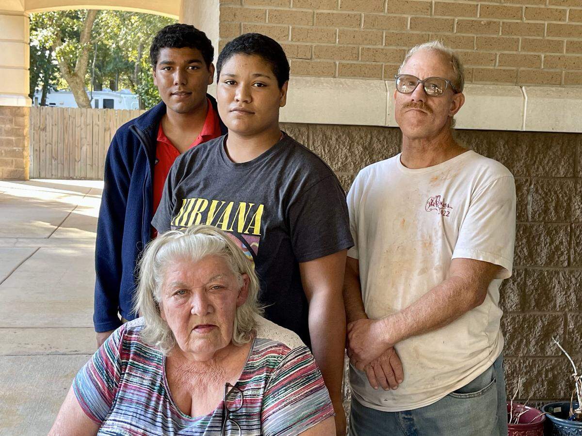 Anita Seymour (front) brought her grandchildren to the Donal Snyder Community Center in Biloxi to vote for the first time. Casting ballots with her were grandchildren DeShawn Donaldson (left), 19, granddaughter Angelina Donaldson (center) 18, and son Timothy Seymour.