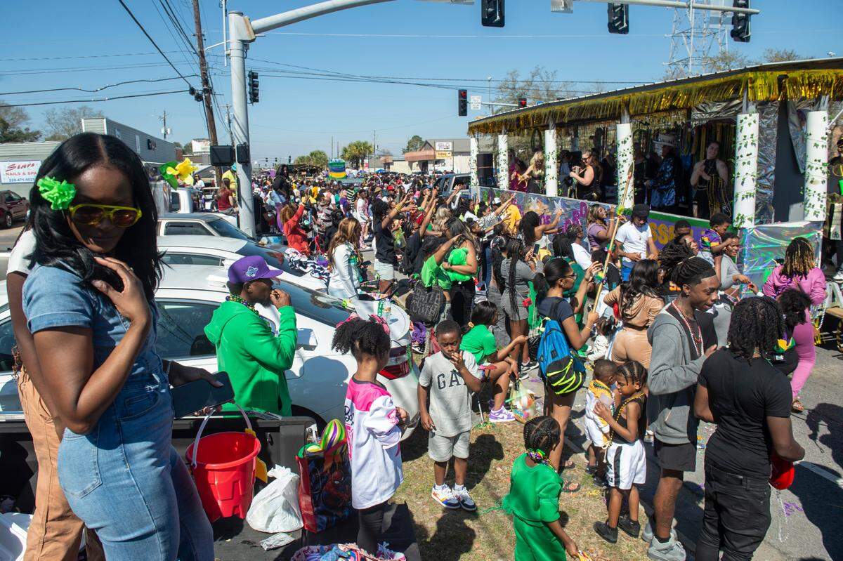 The Jackson County Carnival Association Mardi Gras parade makes its way along Market Street in Pascagoula on Saturday, March 1, 2025.