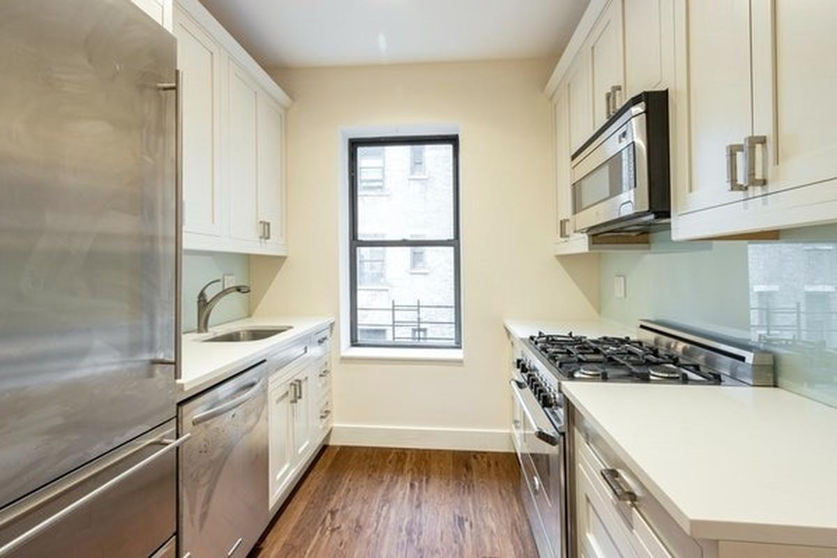 The New York City property features an oversized eat-in-kitchen with high-end appliances.