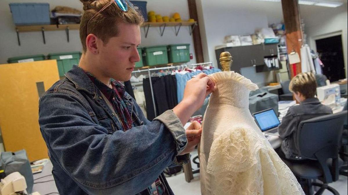 Tieler Garsaud, a junior at New Orleans Center for Creative Arts, works on a recreation of a 1903 gown from the Titanic in the school lab in New Orleans. Garsaud is a cast member on Lifetime's 'Project Runway Junior' this season.