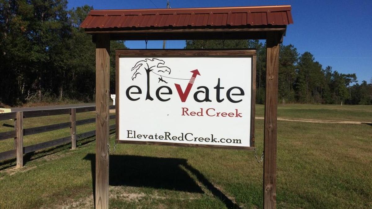 Entrance sign to Elevate Red Creek aerial adventure park.