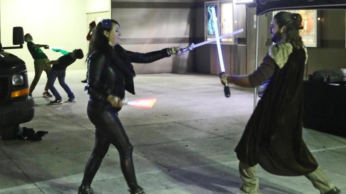 Star Wars fans battle with light sabers outside the D’Iberville Grand Theater in 2015.