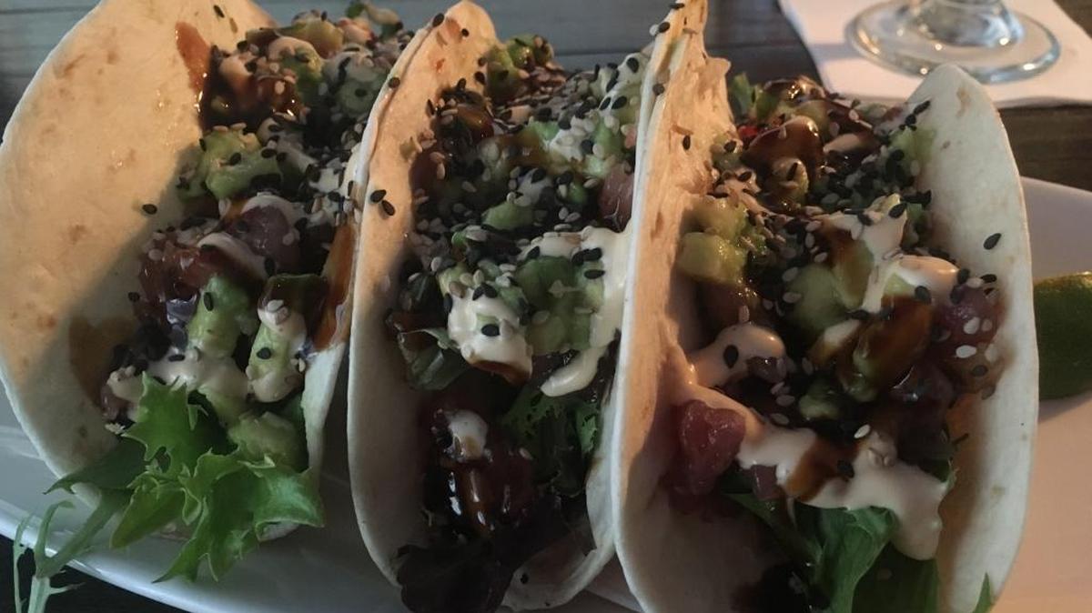 Tuna Stack Tacos are three flour tortillas with harvest lettuce and yellowfin sashimi, garnished with fresh avocado, Sriracha lime mayonnaise, Unagi sauce and sesame seeds. They are on the lunch menu at Rackhouse Steaks & Spirits in downtown Gulfport. Rackhouse has been offering lunch six days a week since early December.