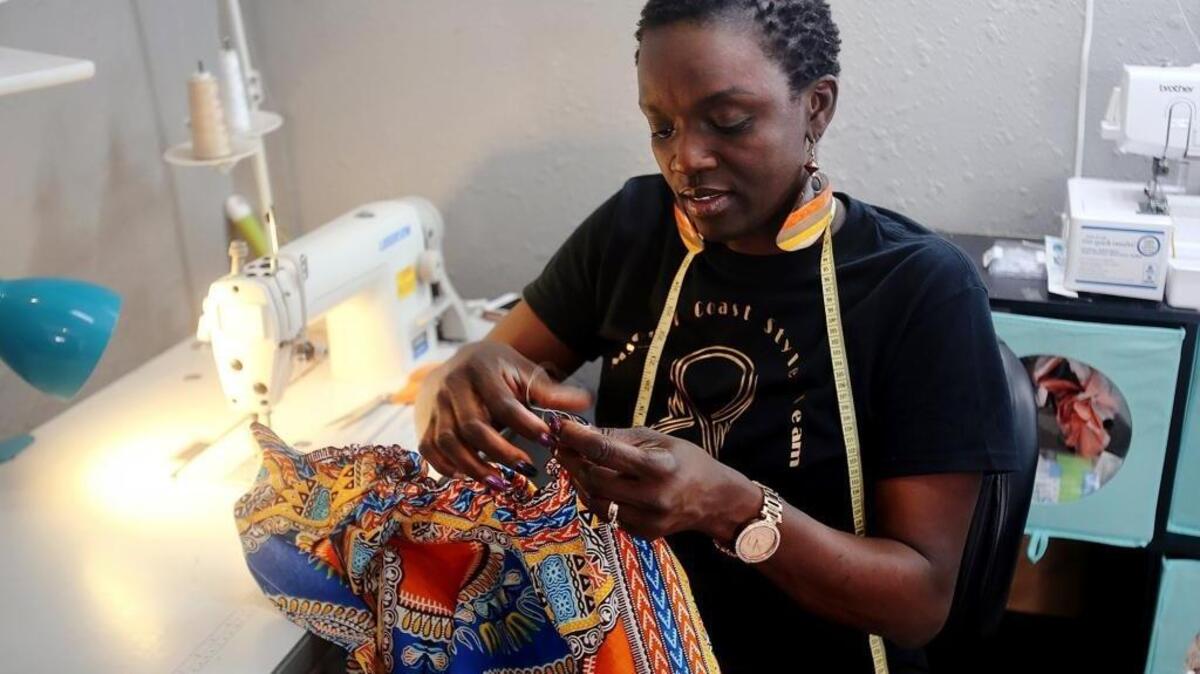Gulfport's Nadine Hancock works on one of the many prom dresses she is creating this season for Coast high schoolers on Monday, March 19, 2018. Hancock is one of the 10 finalists in the annual Top Design Competition, presented by New Orleans Fashion Week.