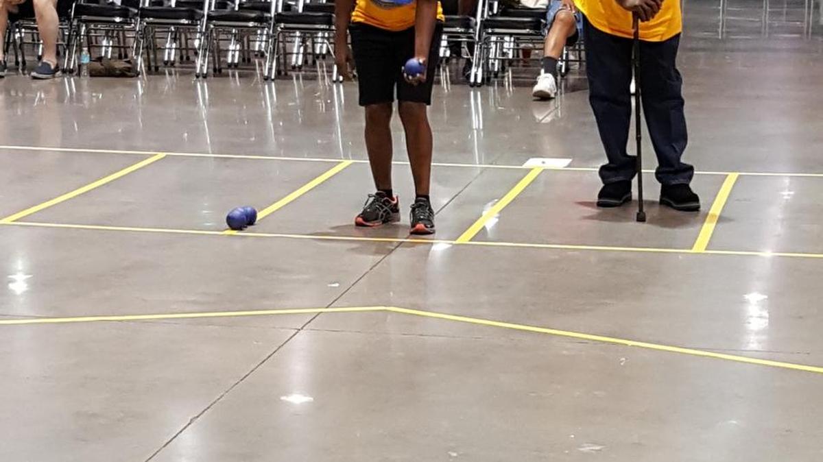 Linda Bowers goes against Alphonso Ogletree in a Boccia Ball match at the Golden Age Games.’