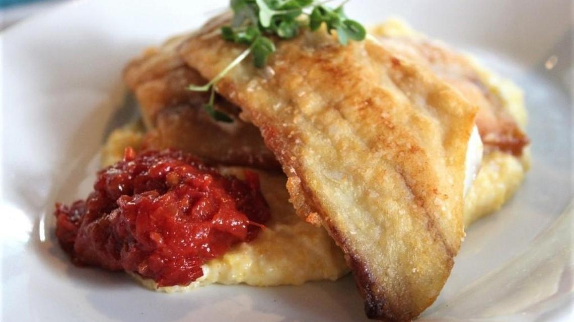 Catfish served with cheese grits and tomato chutney is amazing