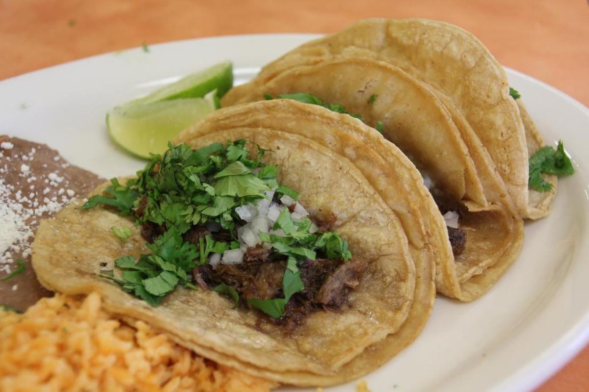 Two corn tortillas are normally served with a Mexican taco.