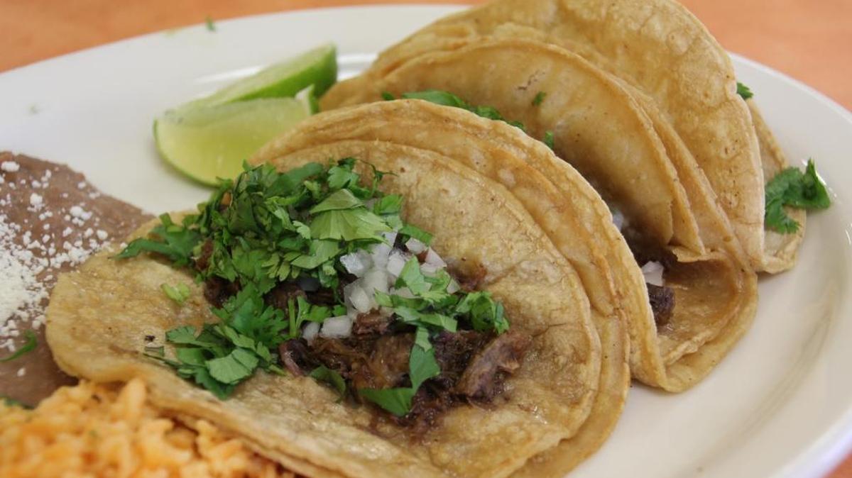 Two corn tortillas are normally served with a Mexican taco.