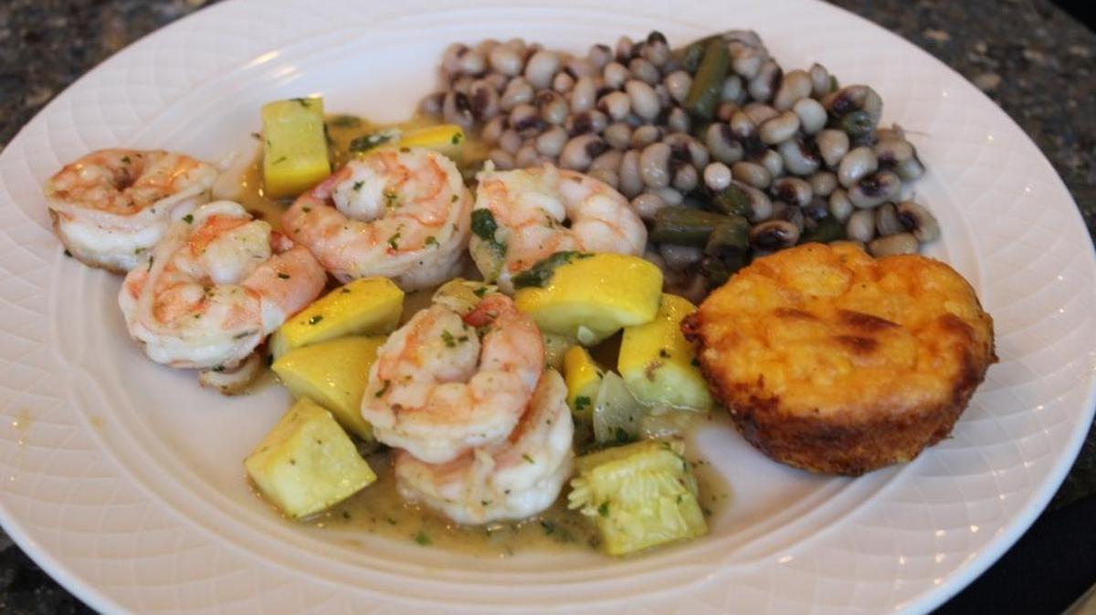 Shrimp and yellow squash with peas and cornbread.