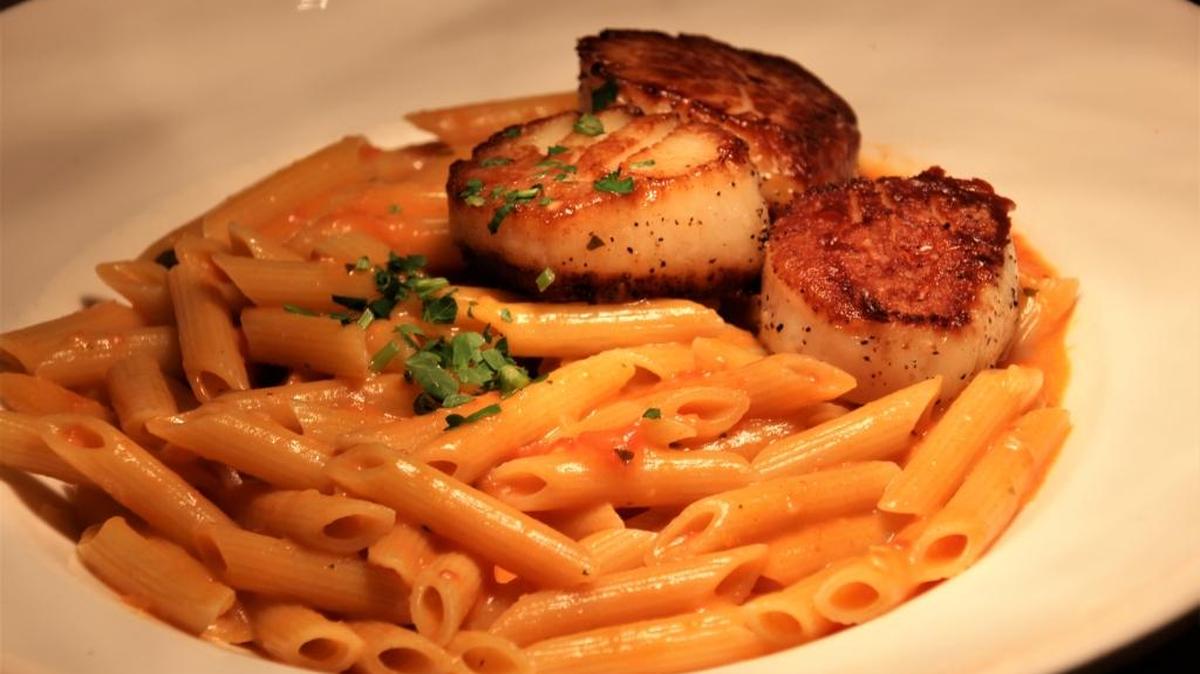 Pan seared scallops pair wonderfully with a simple, buttered pasta.
