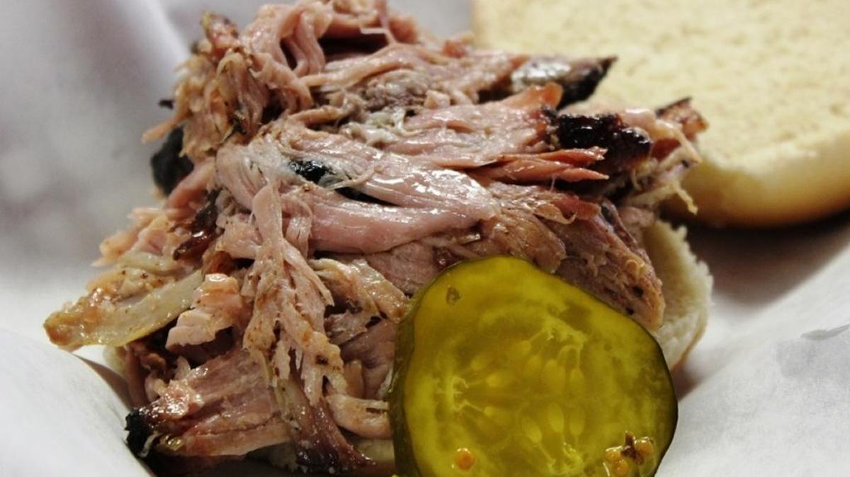 Pulled pork goes well with a pickle on the side.