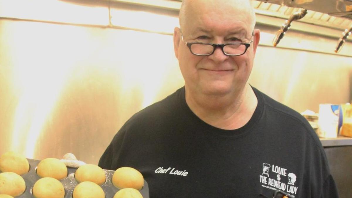Chef Louie Finnan showing off fresh baked bread.