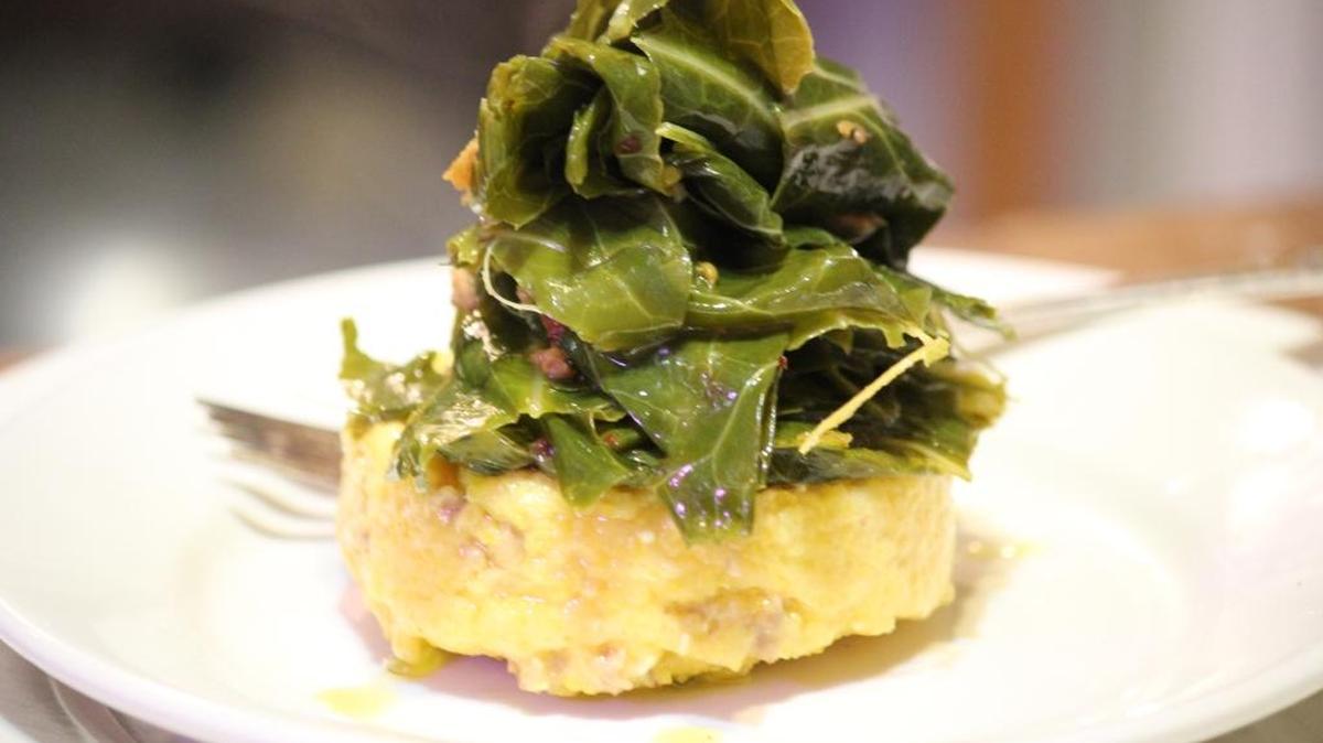 A cheesy grit cake with ham-stock fortified collard greens makes for a great small plate or introduction to a Sunday brunch.