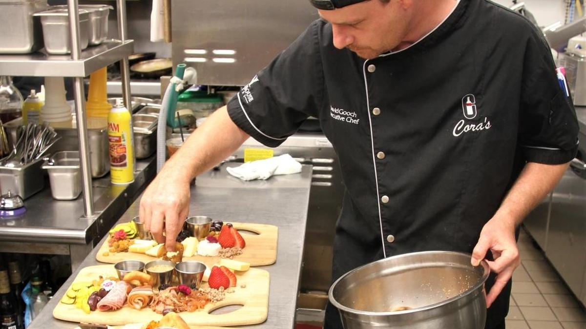 Chef David Gooch preparing charcuterie platters at Cora’s.