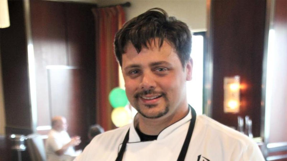 Chef Matthew Kallinikos shows off the wagyu beef Thirty-Two is famous for serving.