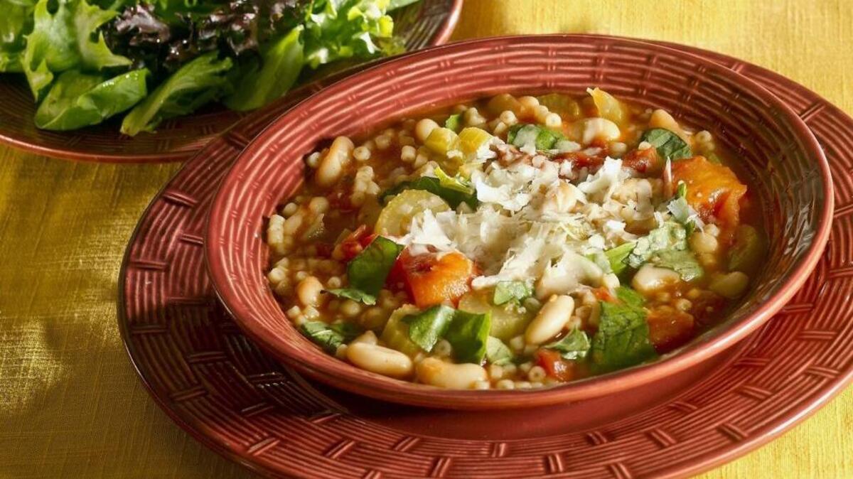 Pasta and bean soup with Italian lettuce salad is heart-warming, and can be served for two or a crowd.