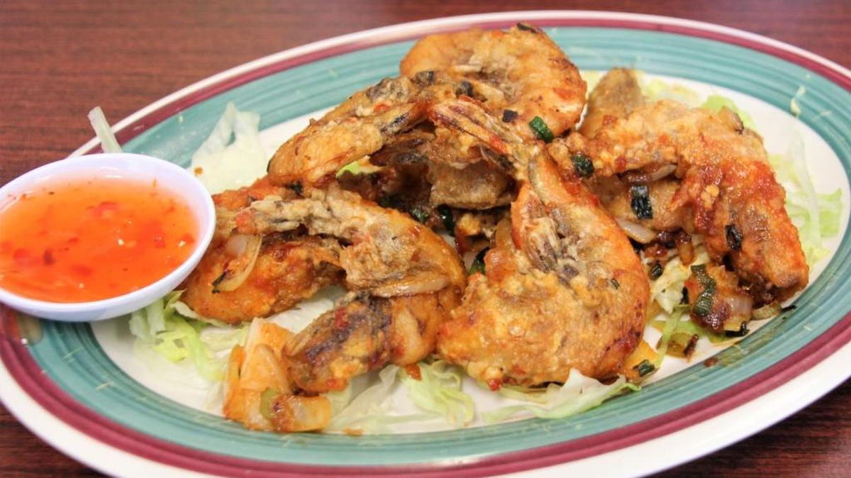Spicy fried shrimp are served shell on.