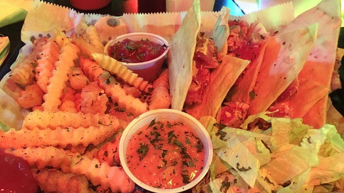 Ahi tuna tacos, which come with crinkle-cut fries and house-made Sweet Fire Sauce and salsa, at Eagle Island Daiquiri Bar & Grill in Long Beach.
