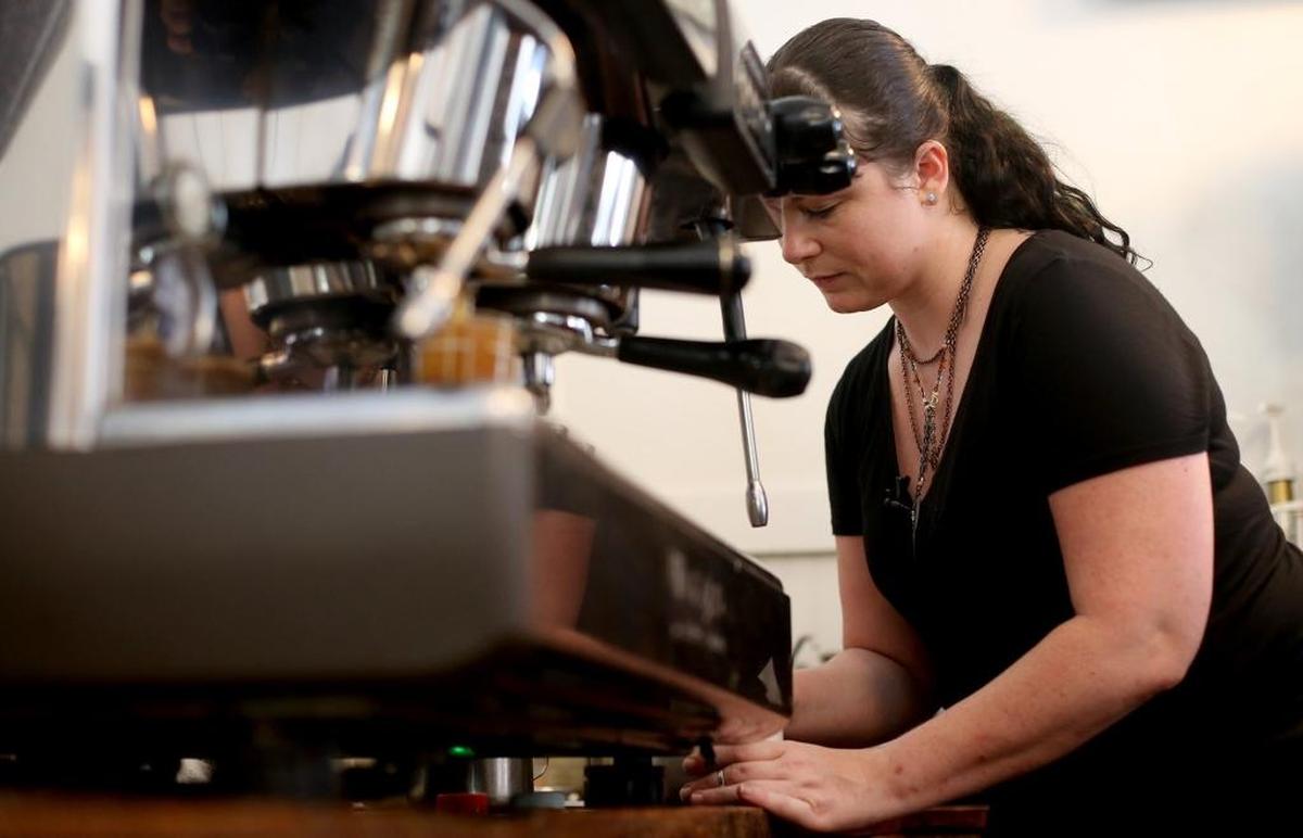 Laura Hurt, a barista at Mockingbird Cafe in Bay St. Louis, demonstrates how to make latte art on Thursday, September 1, 2016.