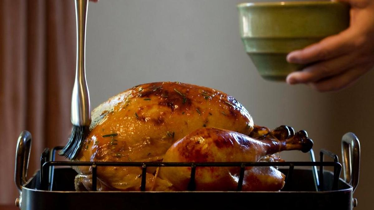 When cooking turkey, use a food thermometer to check that the internal temperature of the inner thigh and the thickest part of the breast reach 165 degrees before removing the turkey from the oven, and let it stand 20 minutes before serving. Always wash the thermometer in between temperature checks.