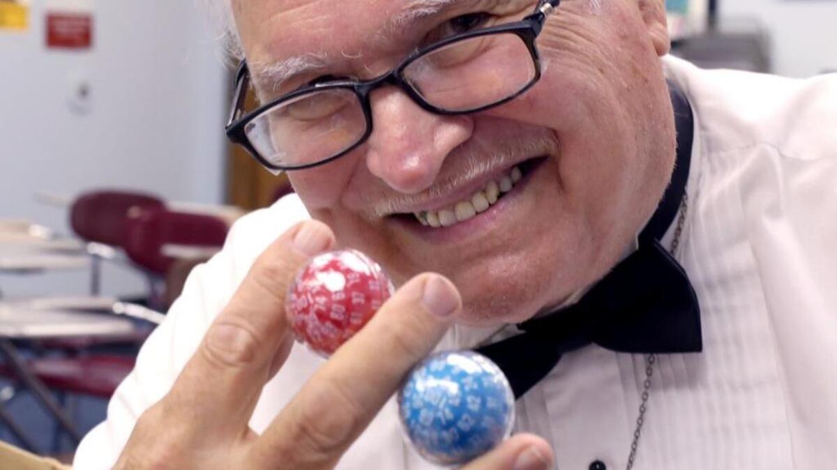 Louis Zocchi displays some of the dice he developed over the years. Zocchi is also a magician, performing at different functions along the Mississippi Gulf Coast. Zocchi was performing at Camp Stanislaus, Wednesday, June 28, 2017.