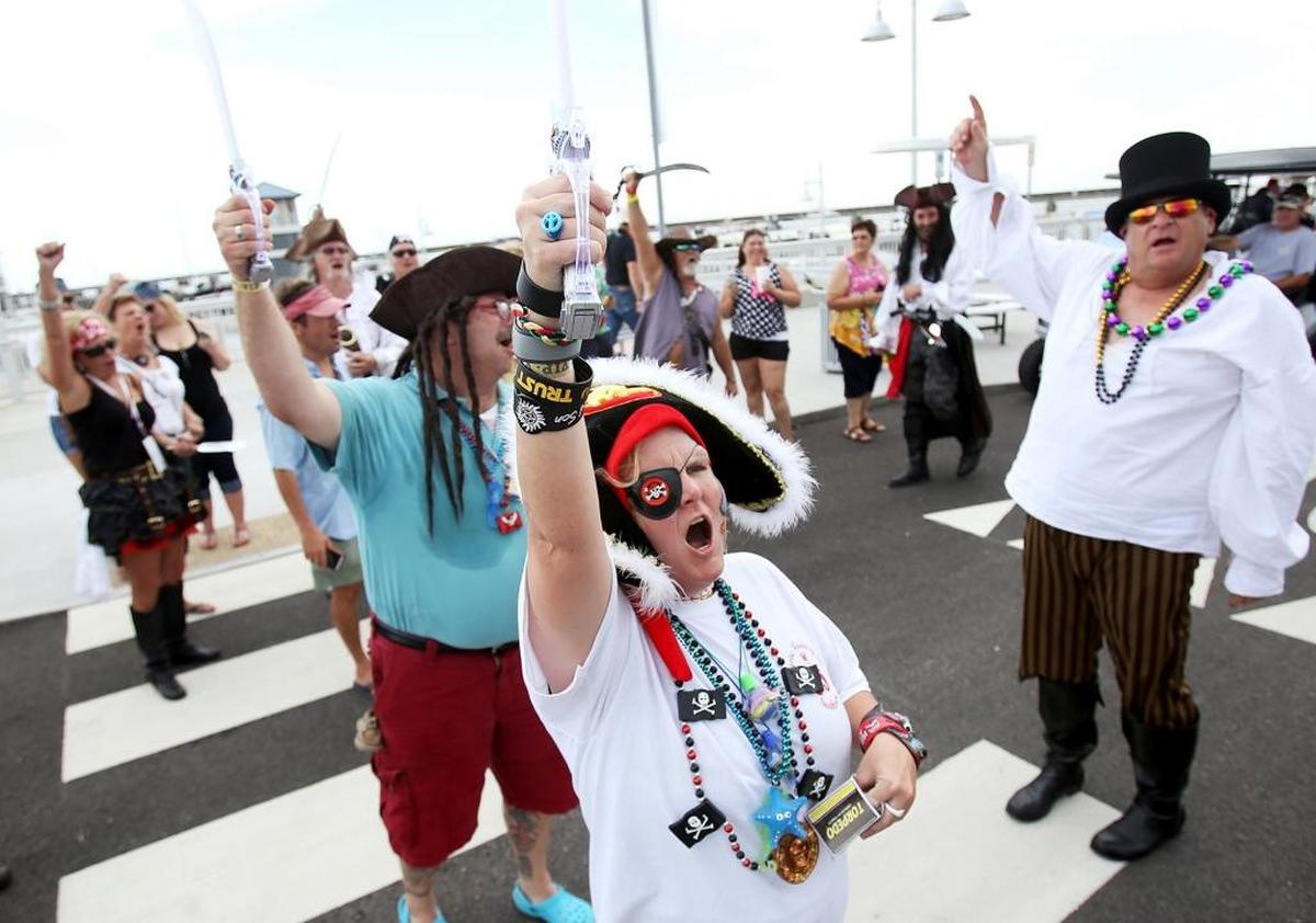 Keisha Stockman, center, and the rest of her band of pirates prepare to march to Bay St. Louis at a past Pirates Day in the Bay. The event brings people to town to eat, drink, shop and be a pirate.