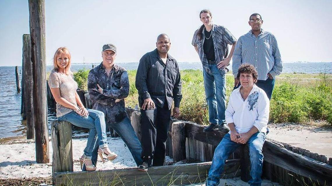 The members of Qrisis are, Tia Black, left, Kevin Williams, Cedric Brooks, Andy Lee, Charles Riley and David Gibson.