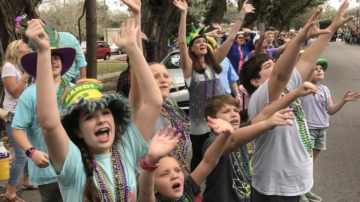 Spectators call for beads at the Ocean Springs Elks Mardi Gras Parade on Saturday, Feb. 11, 2017.
