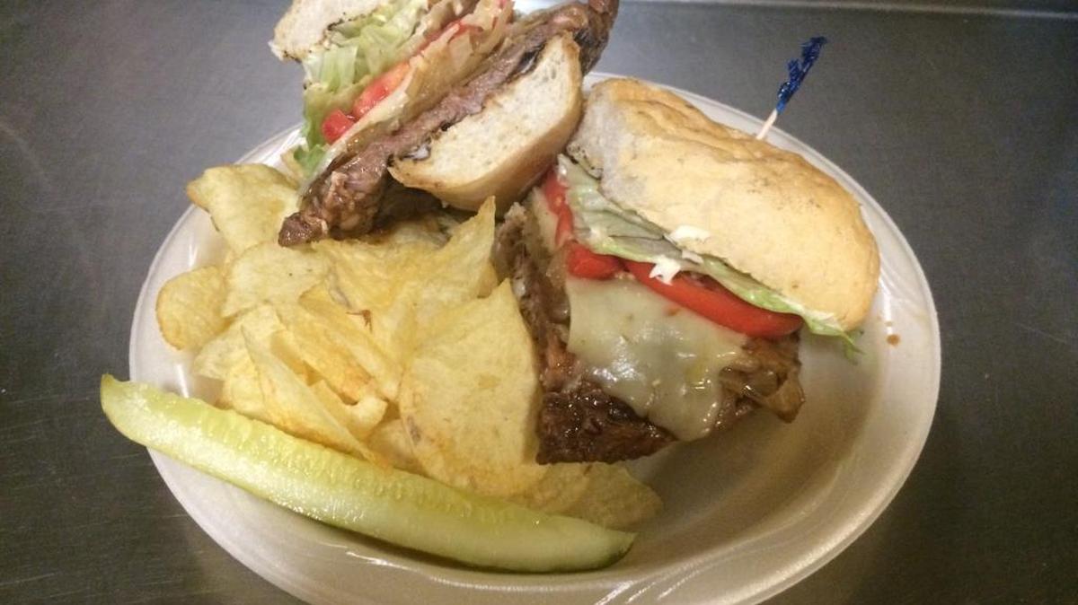 The Project Lounge's well known fresh cut ribeye steak sandwich.