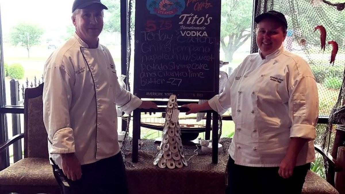 Island View Executive Chef David Crabtree and Amanda Irwin, Beach Blvd. Steamer room chef, stand with their second People’s Choice award from the Gulf Coast Oyster Festival and Cook-Off.