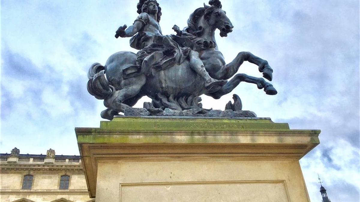 Italian sculptor Gian Lorenzo Bernini interpretation of Louis XIV on a horse stands outside the Musée du Louvre in Paris, France. Louis XIV  hired Bernini to redesign the Louvre but instead he created this statue.