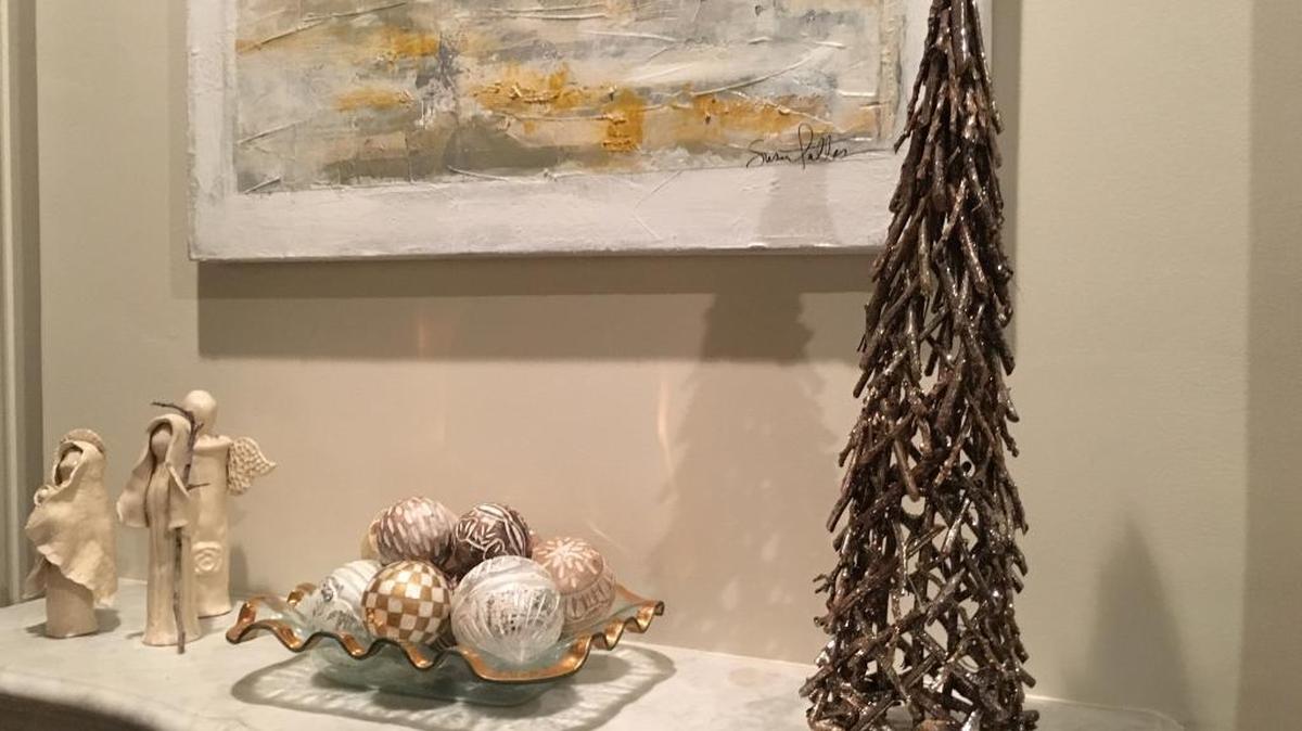 Soft metallics and natural textures accent Christmas decor on a mantel at the home of Sandra and George Boddie in Gulfport. The home is part of the Civic League of Gulfport Christmas Tour of Homes on Dec. 3.