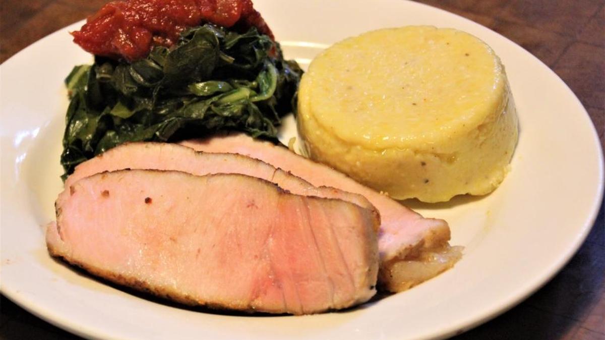 Grits, greens, tomato chutney and tender pork make a great combination.