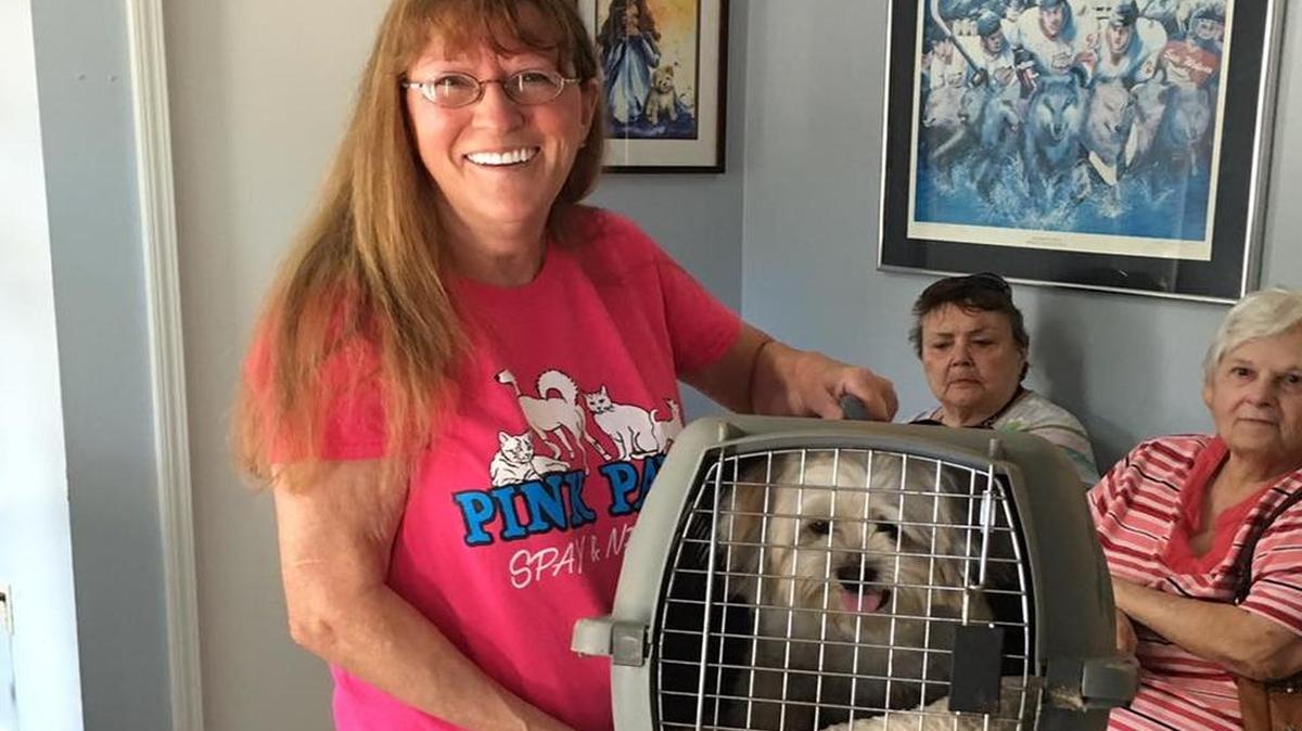 Helene Hicks holds the 3,000th animal her Pink Pawz Spay & Neuter has helped.