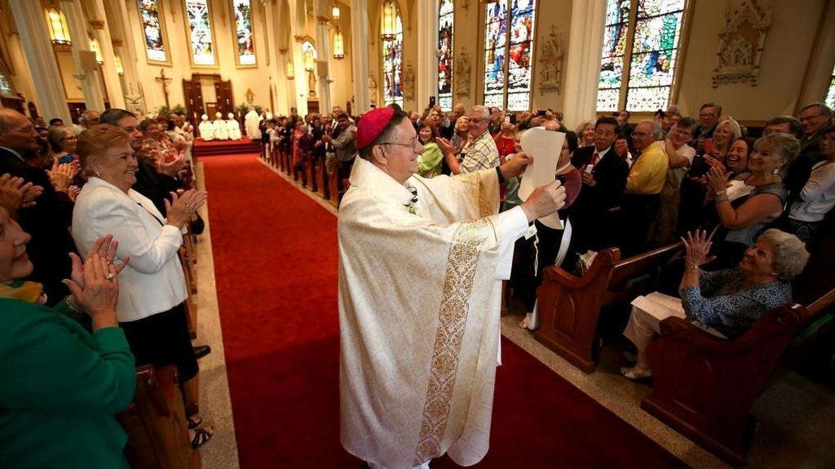 Bishop Louis F. Kihneman III presents the Apostolic Letter to his congregation during his ordination and installation as the fourth bishop of Biloxi on April 28. He and the Most Reverend Joseph Kopacz of Jackson issued a statement Friday criticizing President Donald Trump’s federal budget.