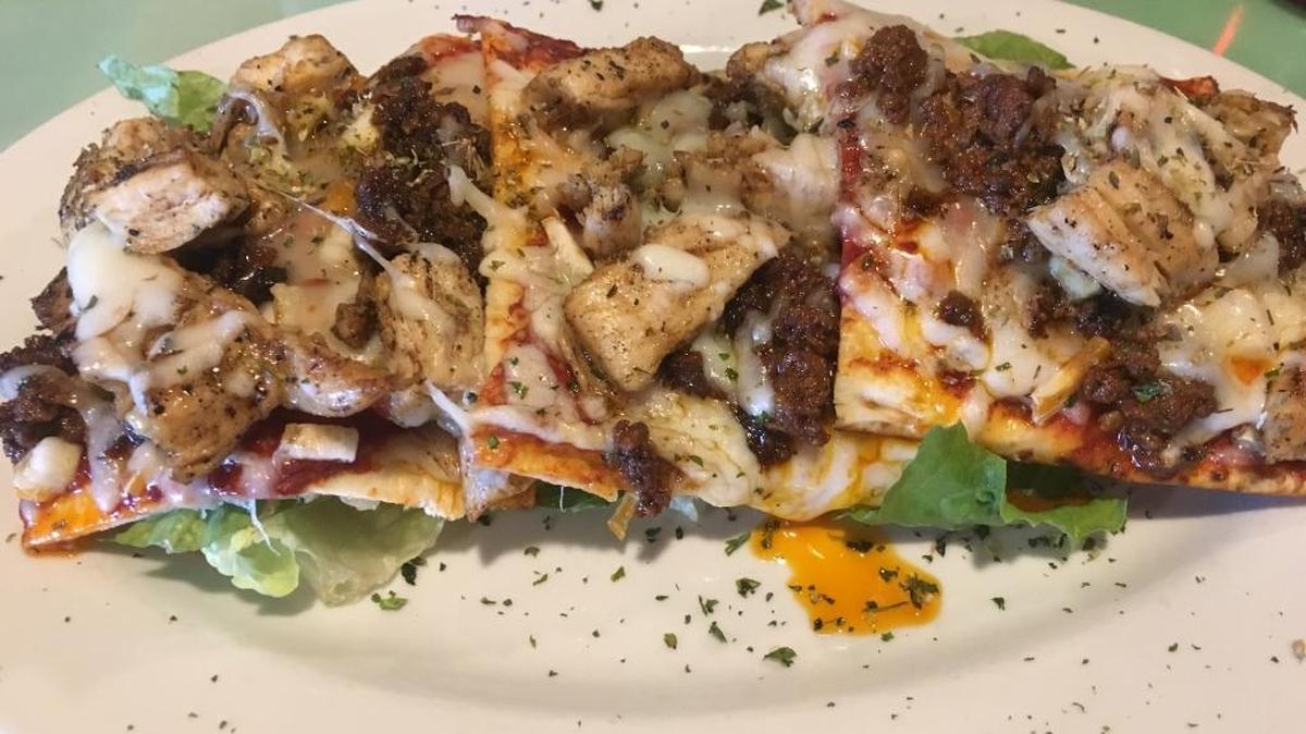 Chicken & Chorizo Pizza is on the appetizer list at Cafe 1310 but makes a more than filling lunch. The pizza, on flatbread, also is pre-sliced for ease in sharing.