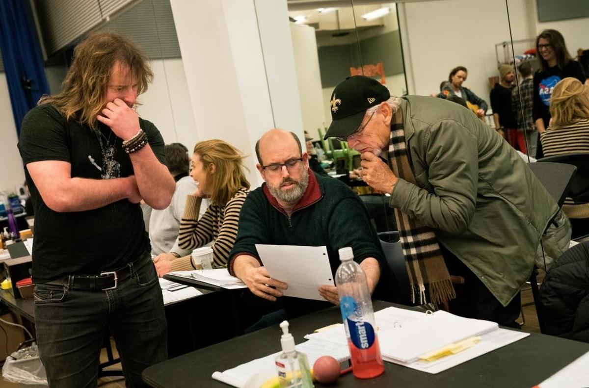 From left, Christopher Jahnke, music supervisor, Christopher Ashley, director, and Jimmy Buffett confer during a rehearsal for ‘Escape to Margaritaville’ in New York on Feb. 2. The show will be Buffett’s first Broadway musical, but not his first musical: In 1997, he and his friend the novelist Herman Wouk wrote one based on Wouk’s 1965 novel, ‘Don’t Stop the Carnival.’