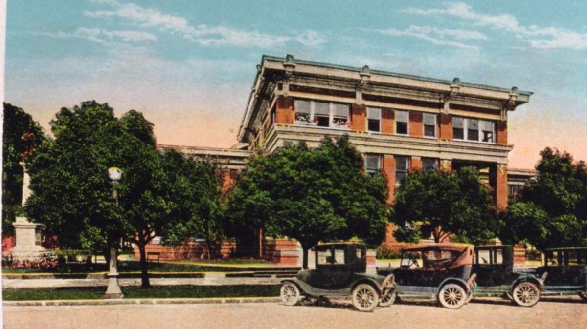 A colorized postcard of cars parked in front of the Harrison County Courthouse in Gulfport is symbolic because it was in 1918, within years of this image, that the state mandated registration for vehicles in every county. Drivers didn’t need licenses for 20 more years.