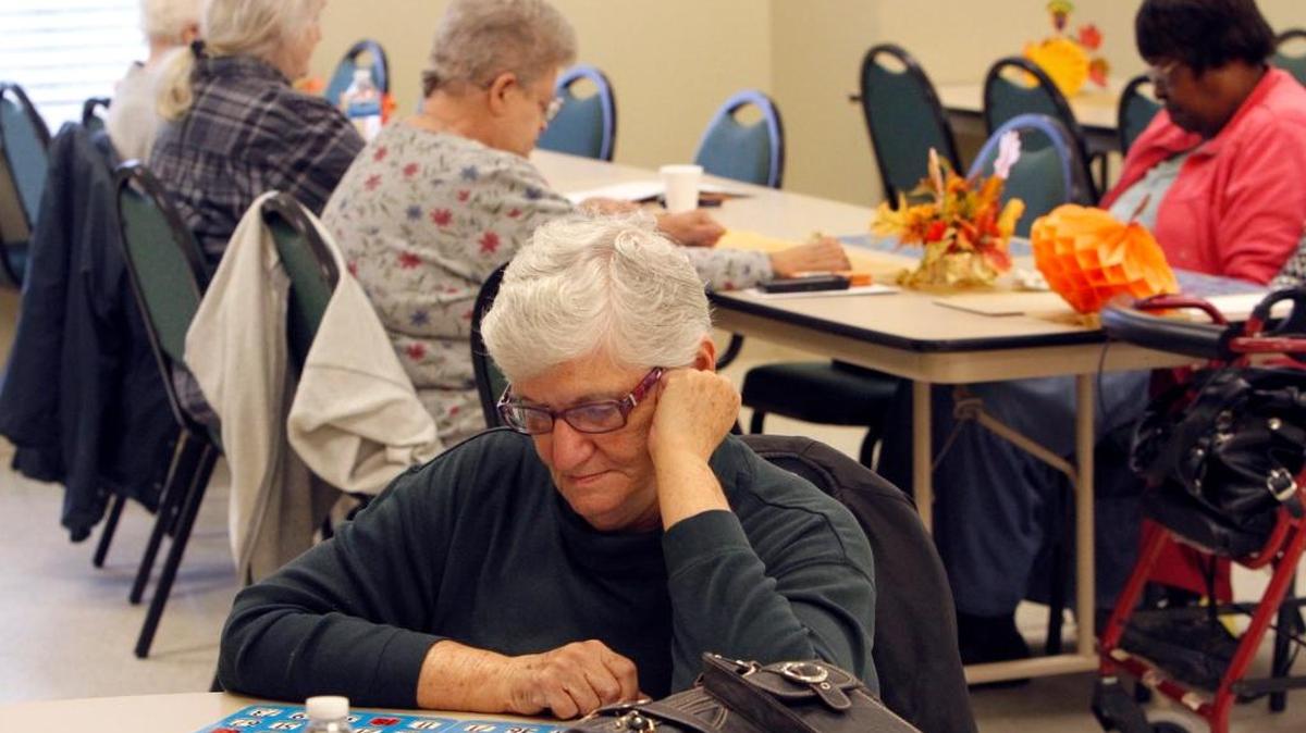 Carol Trickel concentrates on her card during Bingo game at Lyman Senior Center in Gulfport.
