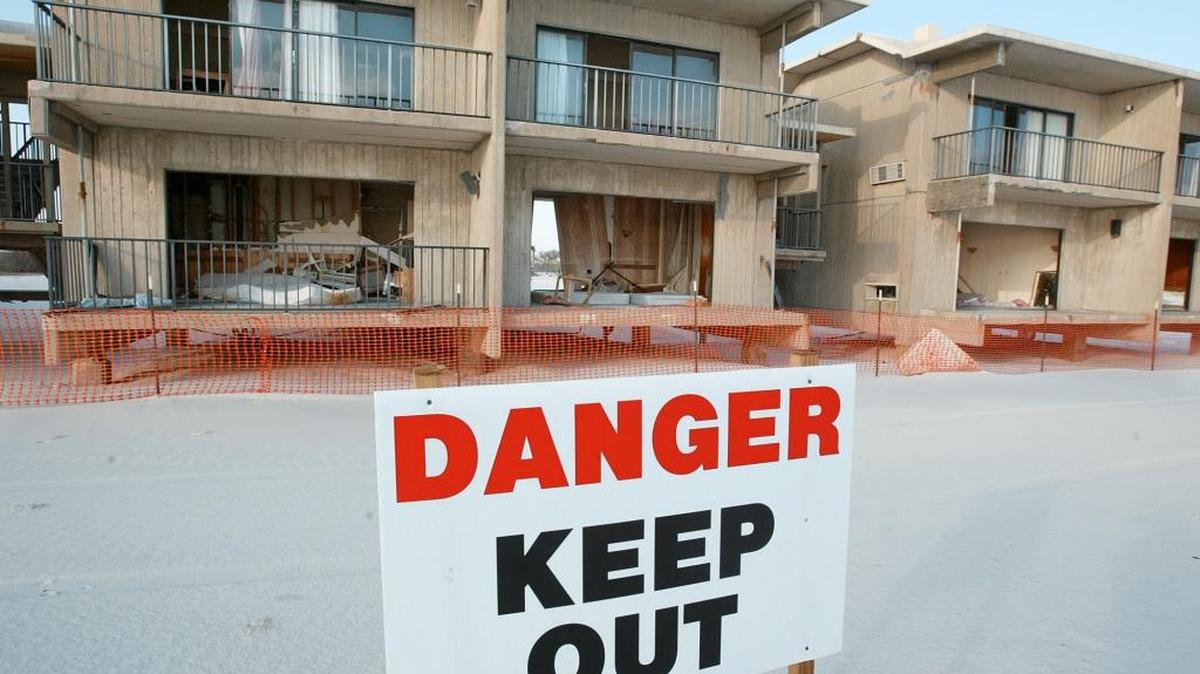 In this photo taken Dec. 1, 2005 a danger sign warns visitors to stay away from the hotel at Gulf State Park in Gulf Shores, Ala. One of the most beautiful pieces of property in Alabama, a sandy white stretch at Gulf State Park, could become the site of a large hotel and conference center.