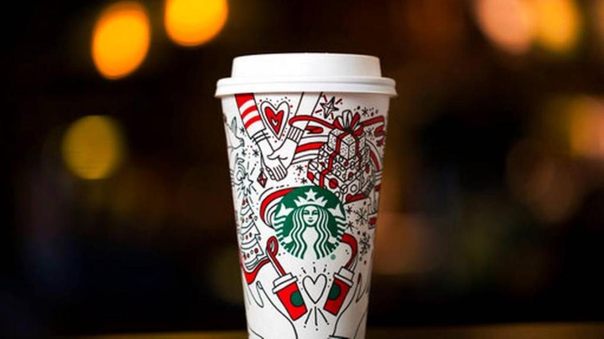 This Monday, Oct. 23, 2017, photo provided by Starbucks shows the company's 2017 holiday cup on display in Seattle. This latest holiday cup is mostly white, for customers to color in themselves.