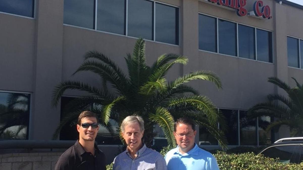Mitchell Distributing, based in Meridian, has purchased Rex Distributing in Gulfport. From left outside the Gulfport company are: Adam Mitchell, president of Mitchell Distributing; Manny Mitchell, chairman of Mitchell Companies, and Evan Athanas, president of Chesapeake Beverage.