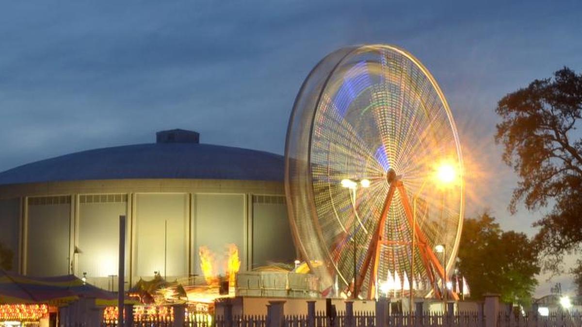 A Ferris wheel spins into action in front of the Coast Coliseum during the Crawfish Festival in 2015. The festival returns April 24-28.