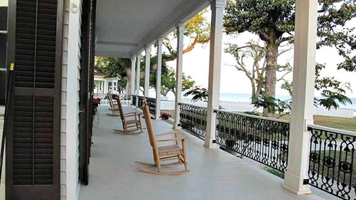 Rocking chairs are lined up on the porch of a Pass Christian home for sale. The average sales price of a home in South Mississippi hit its highest point in July since the end of 2007, two years after Hurricane Katrina and before the national recession hit the Coast.