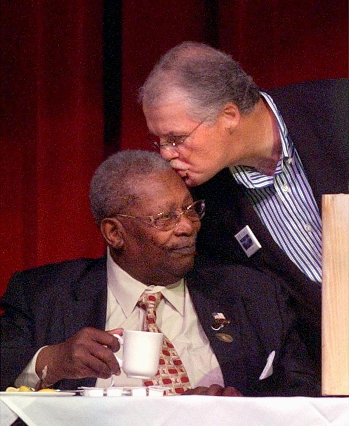 Tim Hinkley, former chief operating officer of the Isle of Capri, kisses Mississippi great B. B. King after discussing the importance of the Blues legend during a roast in Biloxi.