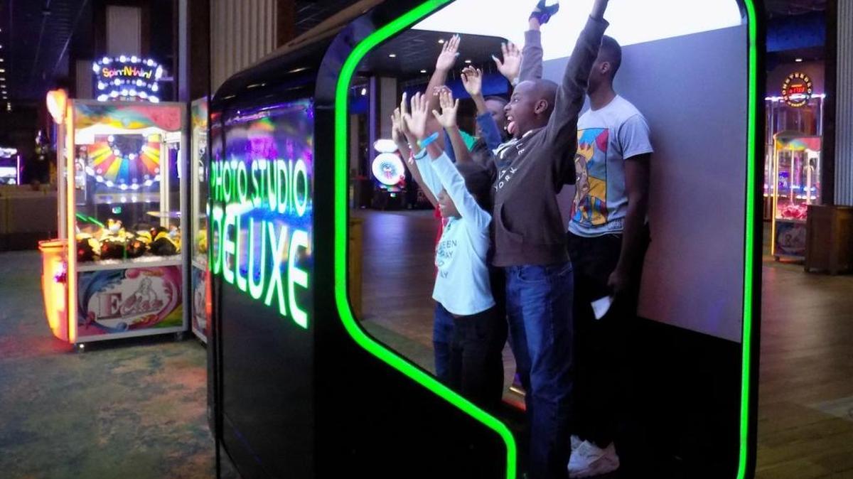 A family from Monroe, La., hams it up for the camera in one of the photo booths at Escape in Margaritaville Resort Biloxi.