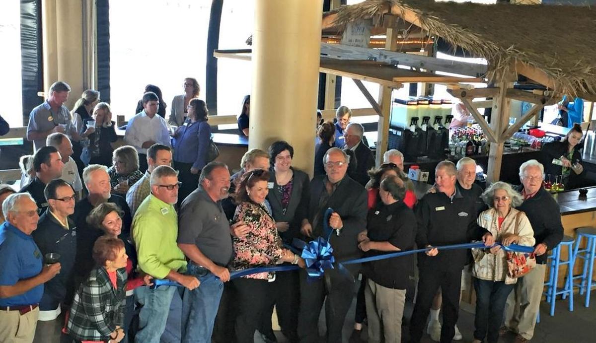 A grand opening and ribbon-cutting ceremony for the new Silver Slipper Beach Bar & Café draws a crowd Thursday during a joint Business After Hours with the East St. Tammany and Hancock chambers of commerce. A swimming pool also is under construction at Silver Slipper.