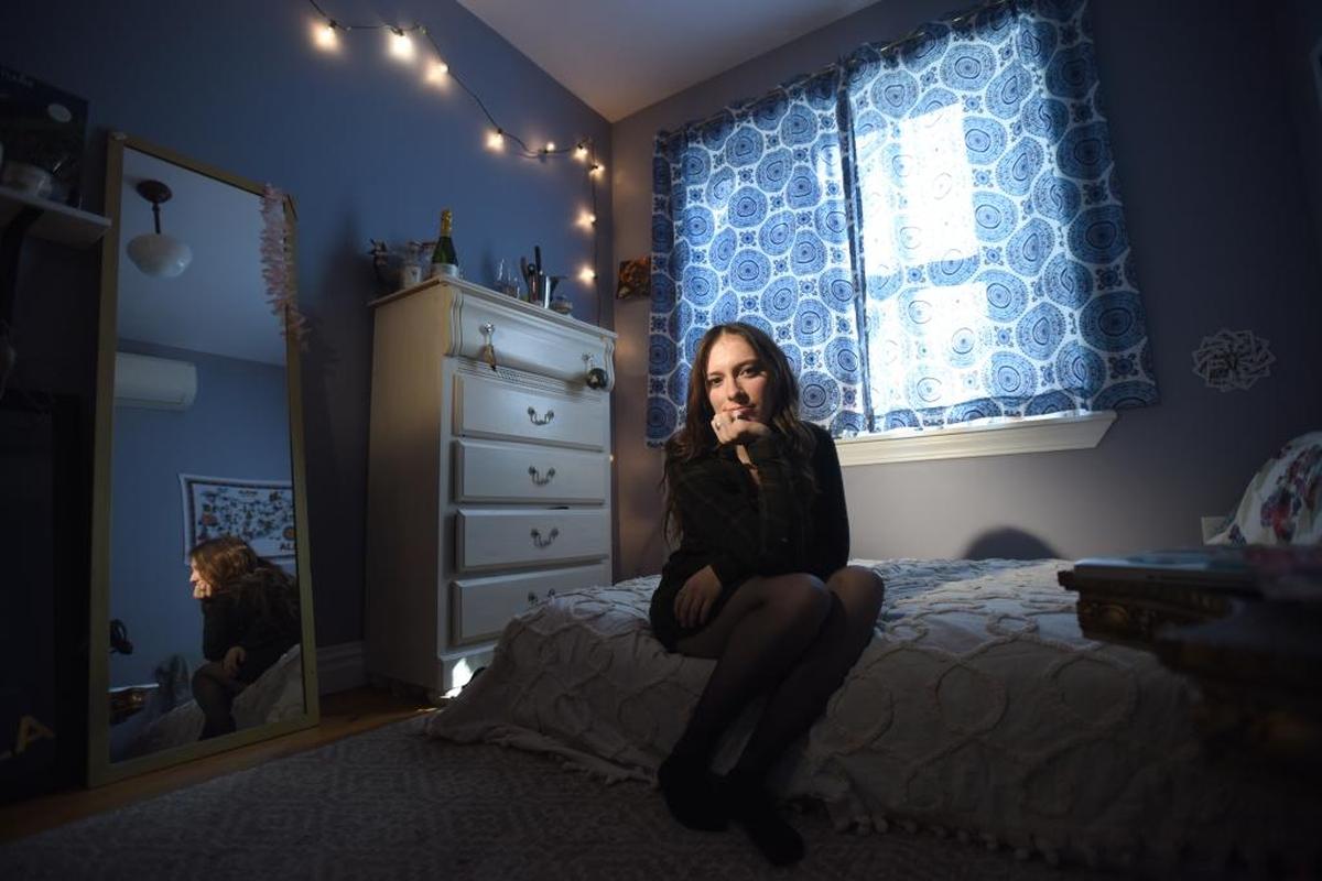 Marisa Licandro, at her home in Brooklyn, alleges that a fellow student who worked with her at a campus-run restaurant attempted to rape her.