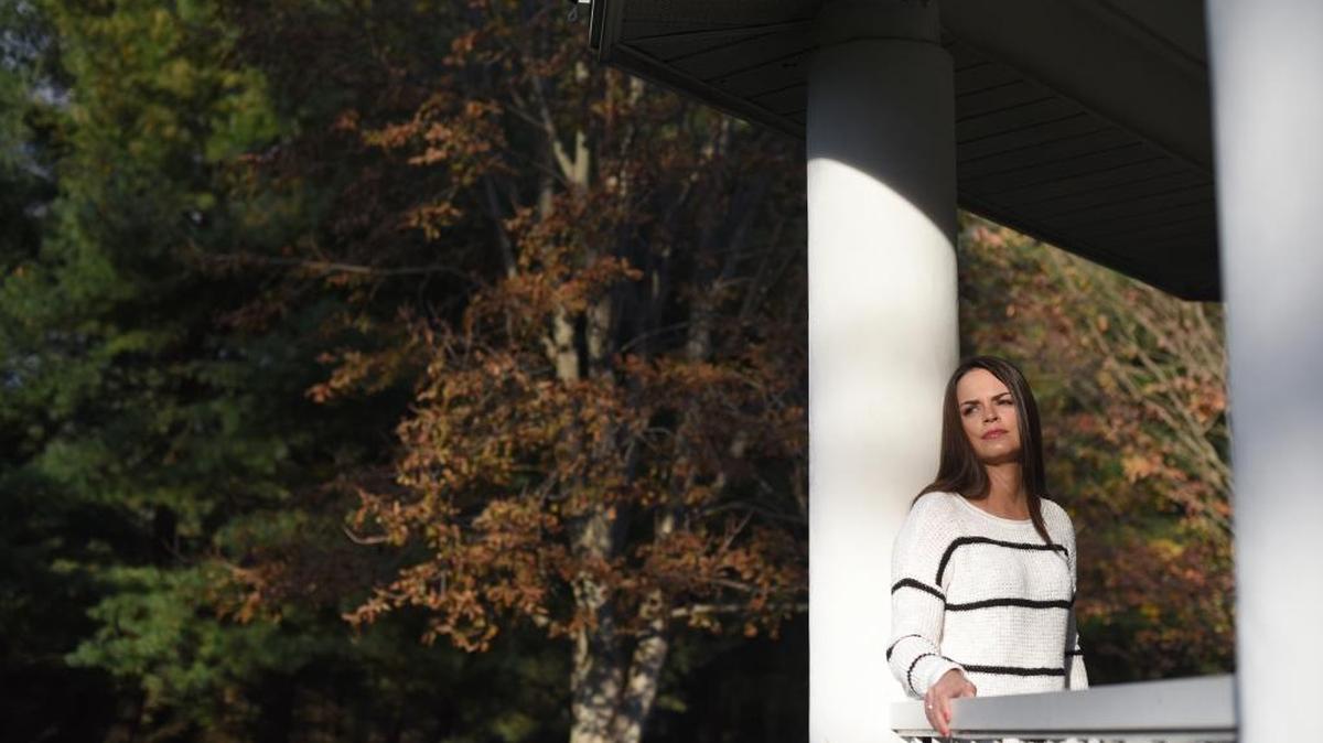 Stefanie Williams, shown in Garden City, N.Y., says that when she was a cocktail waitress at a New York City steakhouse, a customer grabbed her under her skirt.