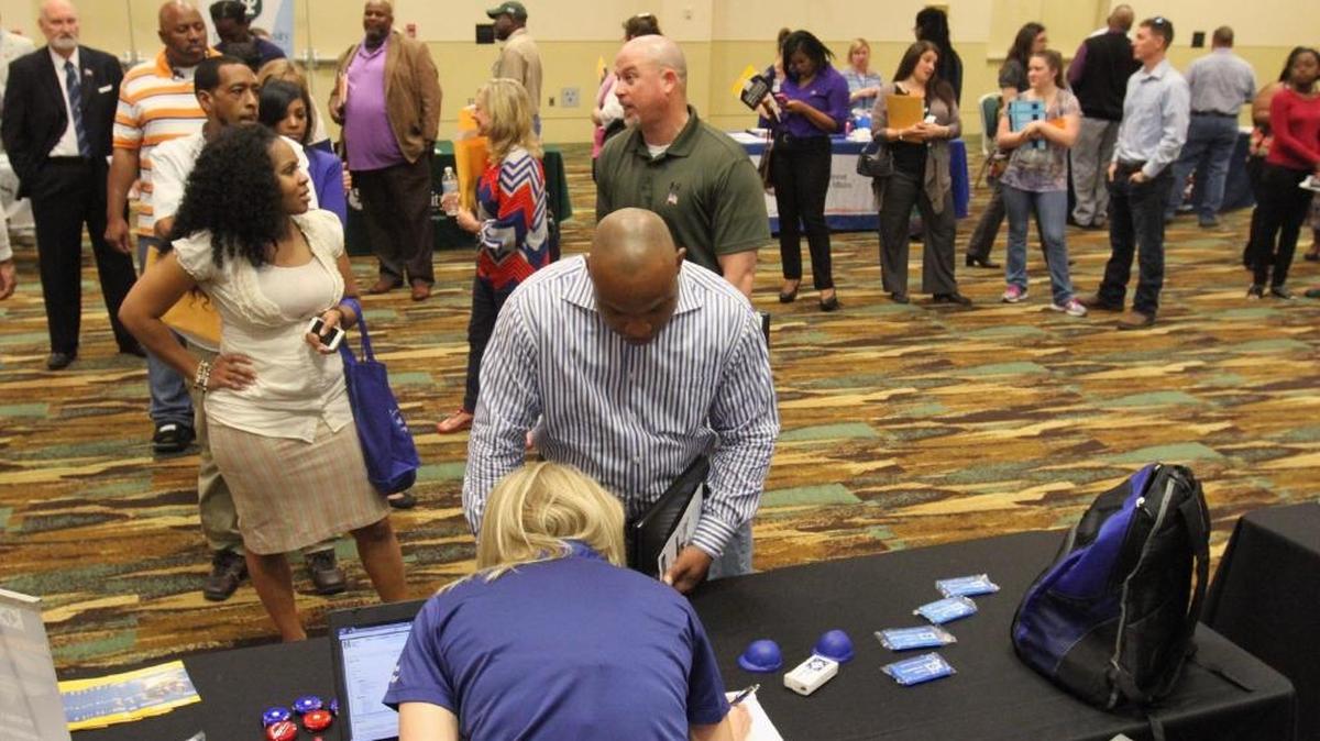 People stand in line during a job fair at the Mississippi Coast Convention Center in Biloxi in 2016. Unemployment in two of the three counties in South Mississippi is below the state average of 4.8 percent in November, which state officials says is the lowest ever recorded in the state.